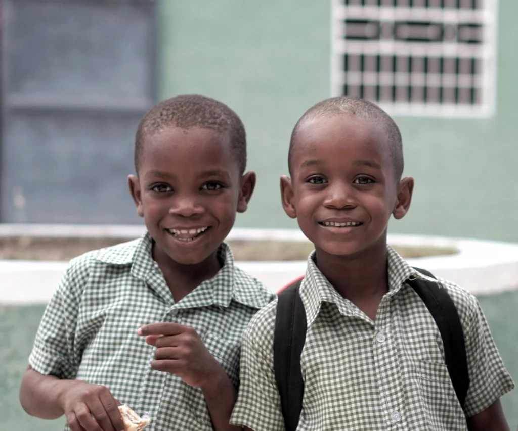 kids in uniform smiling